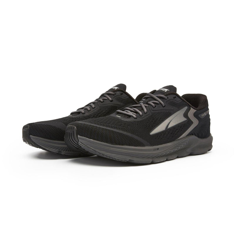 A pair of black running shoes on a white background