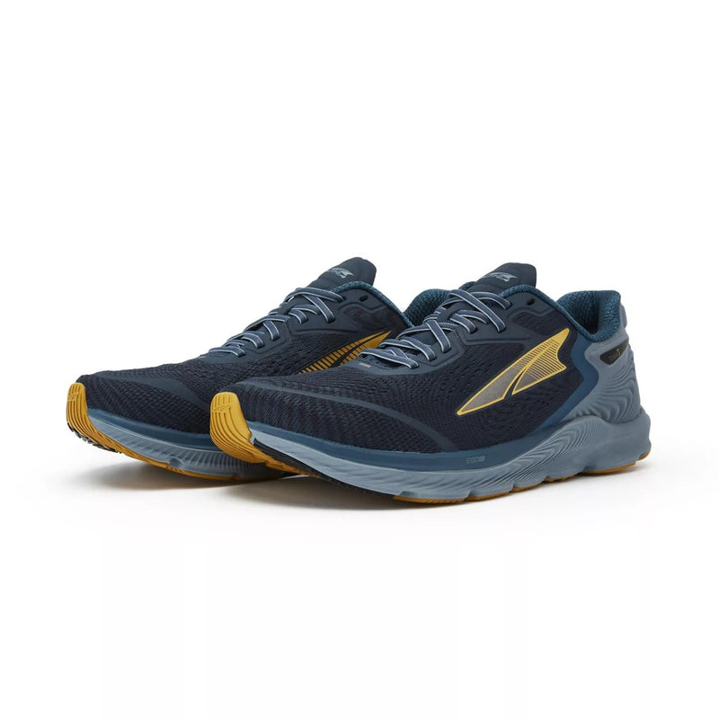 A pair of blue running shoes on a white background