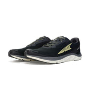 A pair of black running shoes with white bottoms on a white background