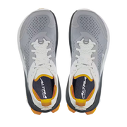 Top view of a pair of grey hiking shoes with white and orange accents against a white background. 