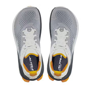 Top view of a pair of grey hiking shoes with white and orange accents against a white background. 