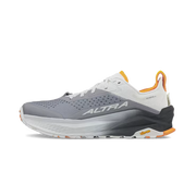 Side view of a grey hiking shoe with white and orange accents against a white background.