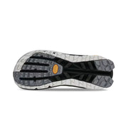 Bottom view of a hiking shoe with a black, grey, and white tread against a white background. 
