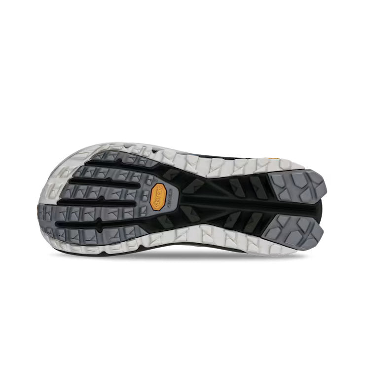 Bottom view of a hiking shoe with a black, grey, and white tread against a white background. 