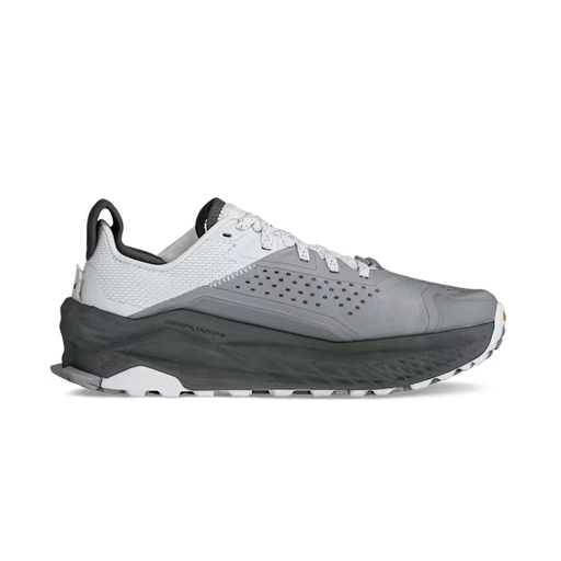 Side view of a gray and white hiking shoe against a white background. 