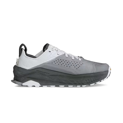 Side view of a gray and white hiking shoe against a white background. 