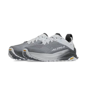 Side view of a pair of gray and white hiking shoes against a white background.