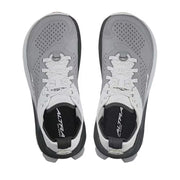 Top view of a pair of white and gray hiking shoes against a white background. 