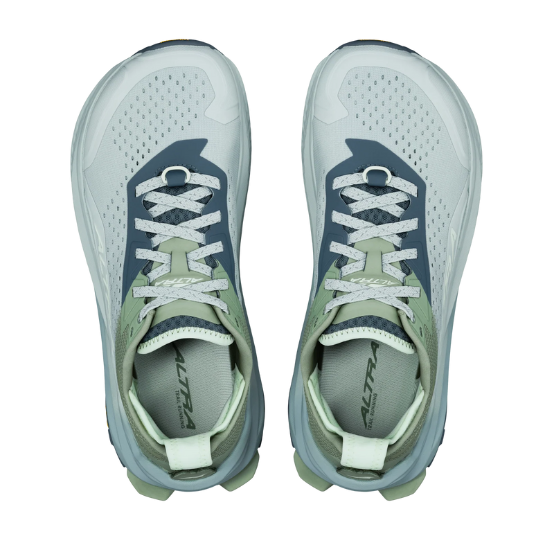 Pair of gray and green athletic shoes on a white background