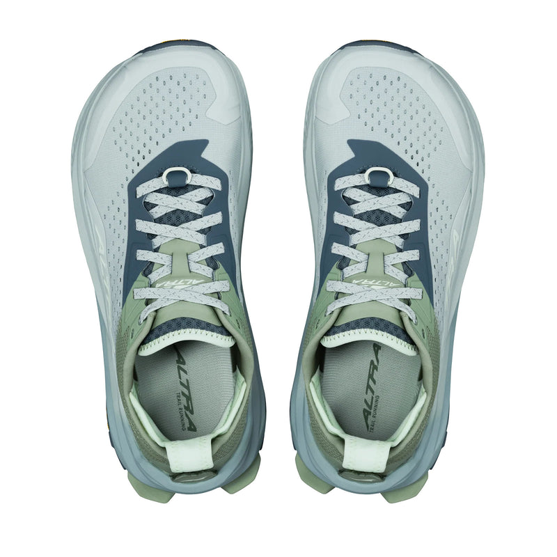 Pair of gray and green athletic shoes on a white background