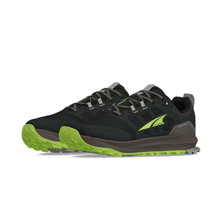 Side view of a pair of black hiking shoes with lime green accents against a white background. 