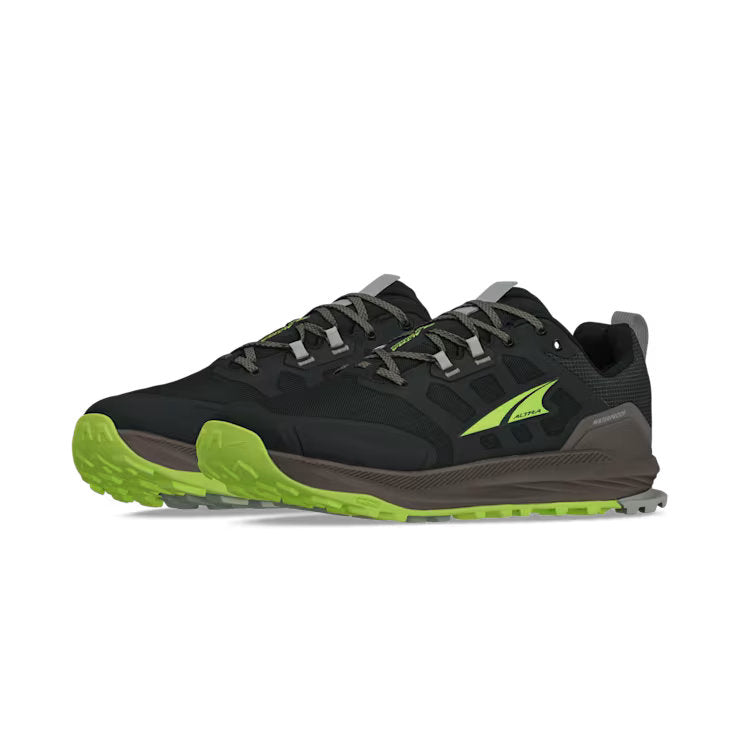 Side view of a pair of black hiking shoes with lime green accents against a white background. 