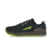 Side view of a black hiking shoe with lime green accents against a white background. 