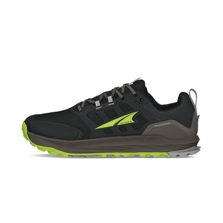 Side view of a black hiking shoe with lime green accents against a white background. 