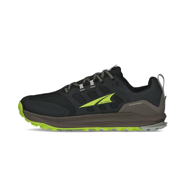 Side view of a black hiking shoe with lime green accents against a white background. 