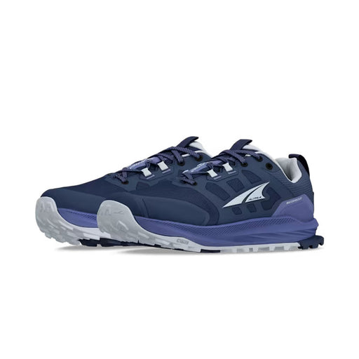 Side view of a pair of dark blue hiking shoes with .ight blue accents against a white background. 