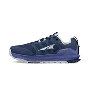 Side view of a dark blue hiking shoe with light blue accents against a white background. 