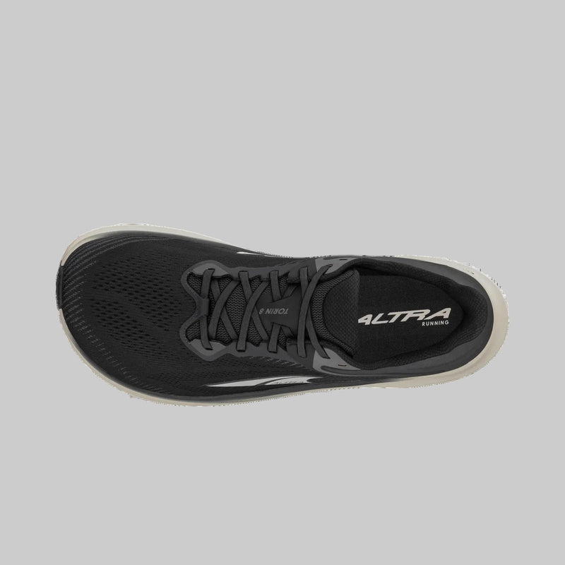 A black running shoe from above on a white background