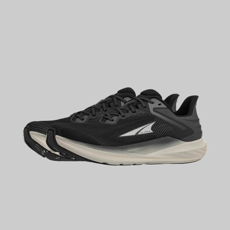 A pair of black running shoes with white bottoms on a white background