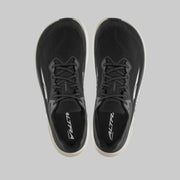 A pair of black running shoes from above on a white background