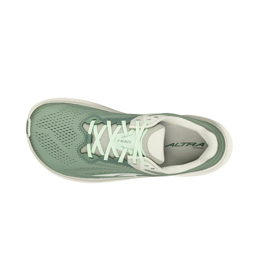 A green running shoe with white details from above on a white background