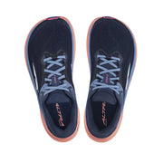 Top view of a pair of navy blue trail running shoes with pink accents and blue laces against a white background. 