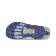 Bottom view of a navy and purple colored trail running shoe. The tread has a dark blue and light blue color to it against a white background. 