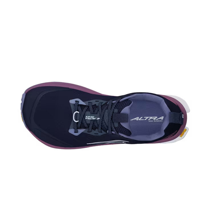 Top view of a navy blue colored trail running shoe with purple accents against a white background. 