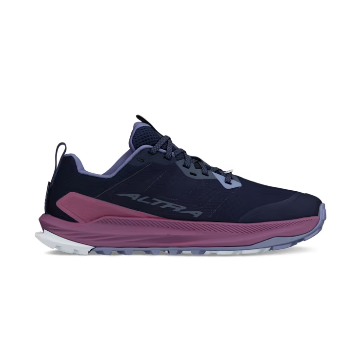 side view of a navy blue colored shoe with purple accents against a white background. 