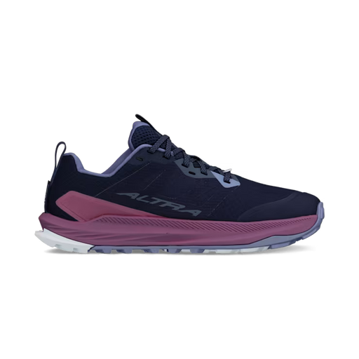 side view of a navy blue colored shoe with purple accents against a white background. 