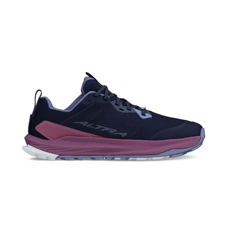 side view of a navy blue colored shoe with purple accents against a white background. 