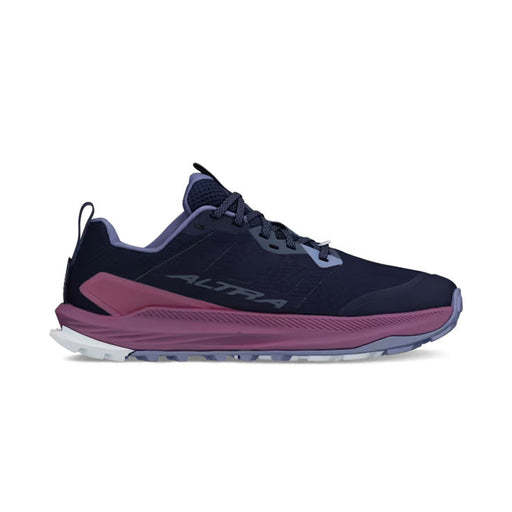side view of a navy blue colored shoe with purple accents against a white background. 