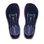 Top view of a pair of navy blue colored shoes with purple accents against a white background. 