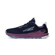Side view of a navy blue trail running shoe with purple accents against a white background. 