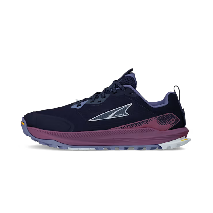 Side view of a navy blue trail running shoe with purple accents against a white background. 