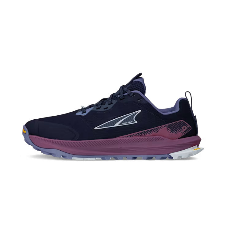 Side view of a navy blue trail running shoe with purple accents against a white background. 