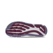 Bottom view of a trail running shoe. The tread has white, white, and gray accents and it sits against a white background. 