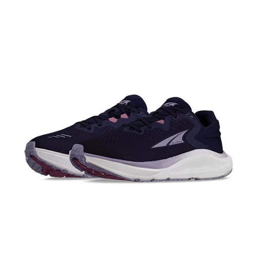 Side view of a pair of navy blue trail running shoes with white accents against a white background. 