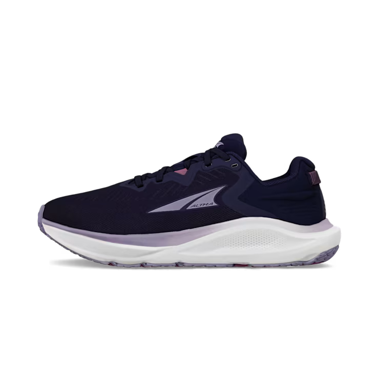 Side view of a navy blue trail running shoe with white accents against a white background. 
