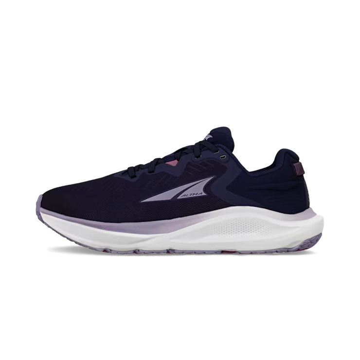 Side view of a navy blue trail running shoe with white accents against a white background. 