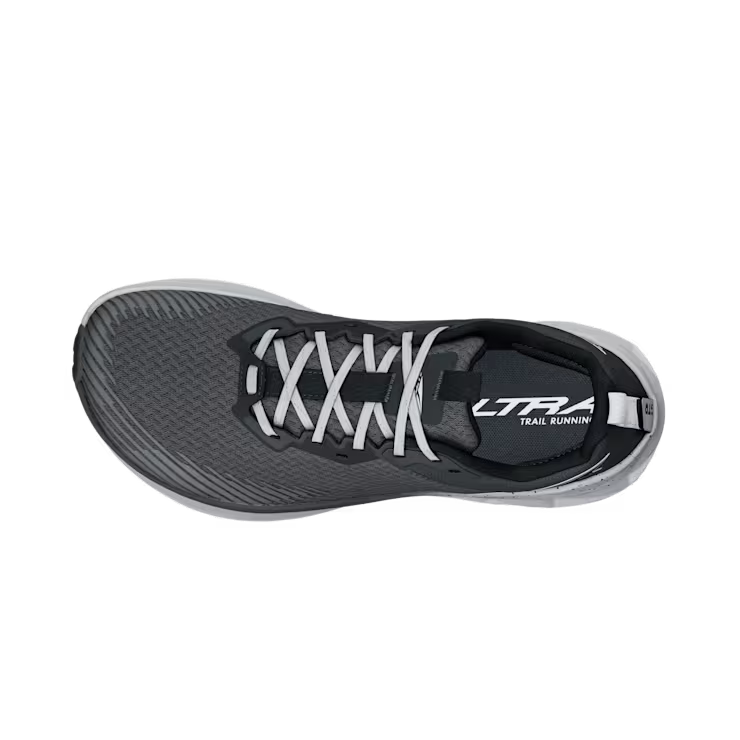 Top view of a gray trail running shoe with white laces against a white background. 