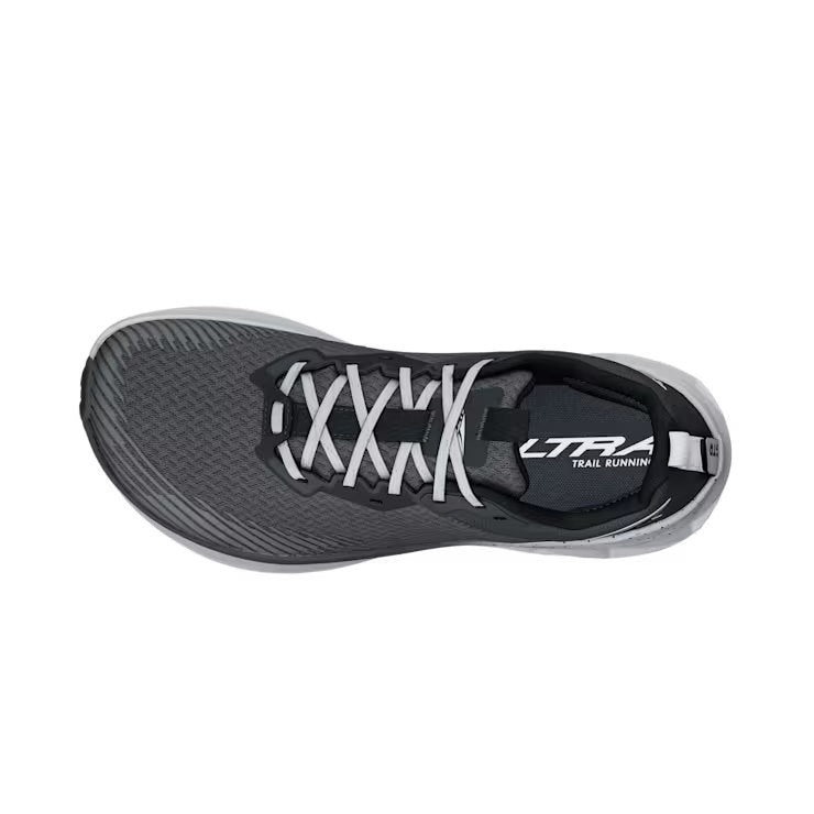 Top view of a gray trail running shoe with white laces against a white background. 