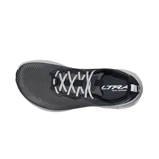 Top view of a gray trail running shoe with white laces against a white background. 