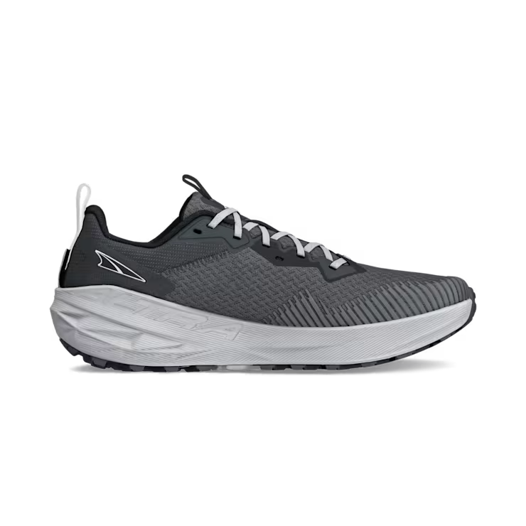 Side view of a gray trail running shoe with white laces against a white background. 