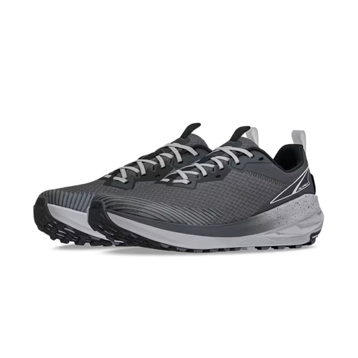 Side view of a pair of gray trail running shoes with white laces against a white background. 