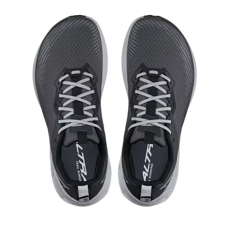 Top view of a pair of gray trail running shoes with white laces against a white background. 