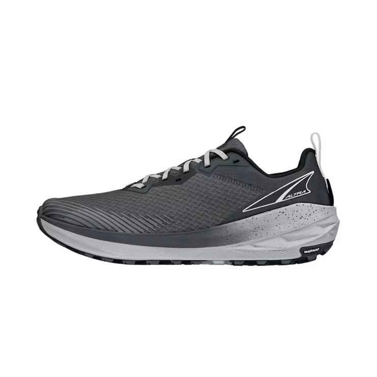 Side view of a gray trail running shoe against a white background. 