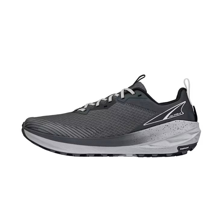 Side view of a gray trail running shoe against a white background. 