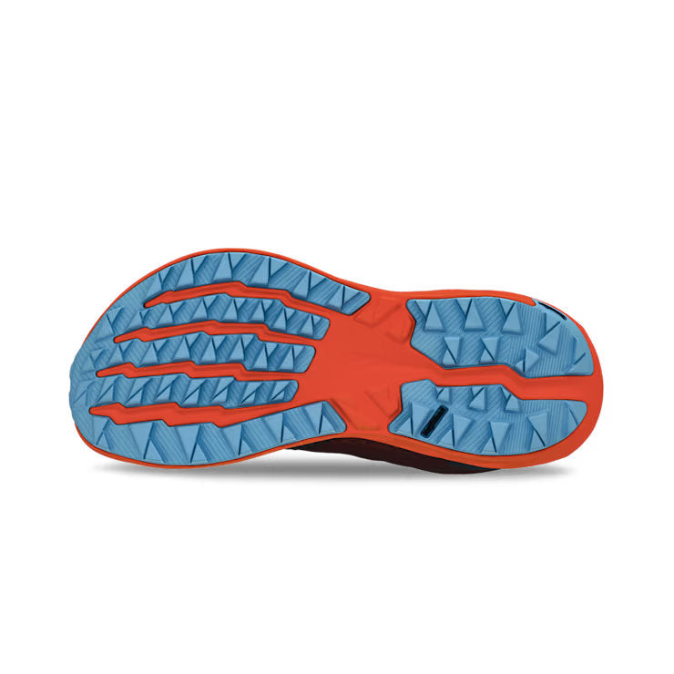 View of the bottom tread of a red and orange trail running shoe against a white background. 