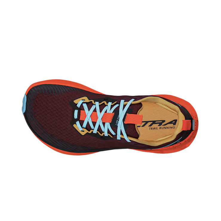 Top view of a red trail running shoe with orange accents and blue laces against a white background.